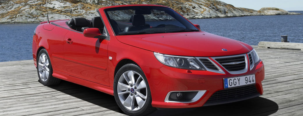 Red convertible parked on dock